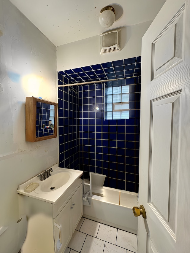 bathroom with a wall mounted air conditioner, vanity, and shower / bathing tub combination