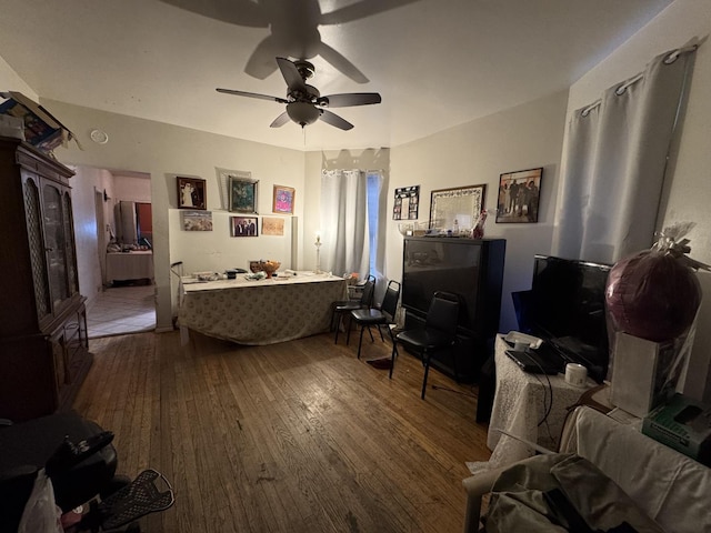 interior space featuring ceiling fan and wood-type flooring