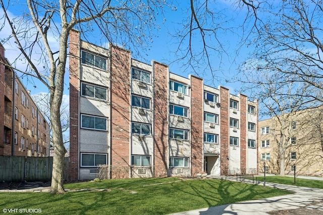 view of building exterior featuring fence