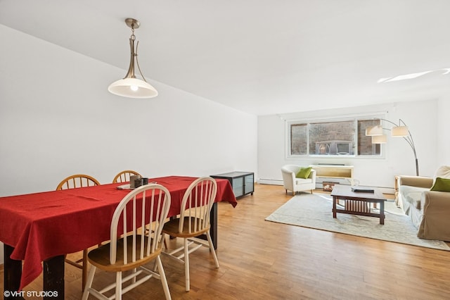 dining area with light wood-type flooring