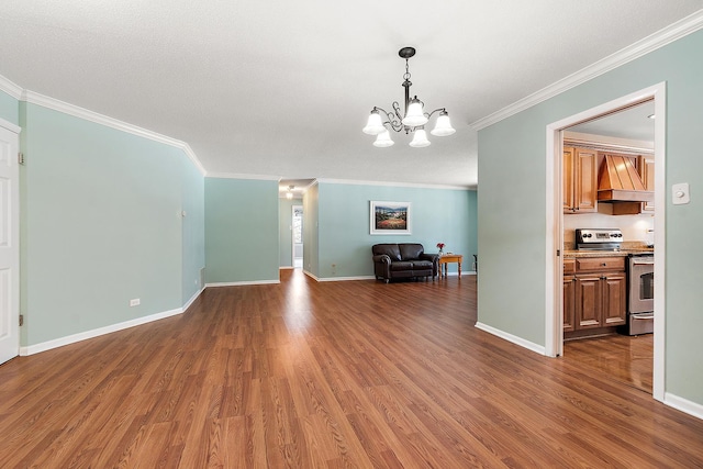 interior space featuring baseboards, crown molding, an inviting chandelier, and wood finished floors