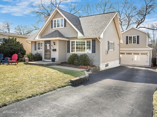 view of front of home featuring a shingled roof, aphalt driveway, an attached garage, and a chimney