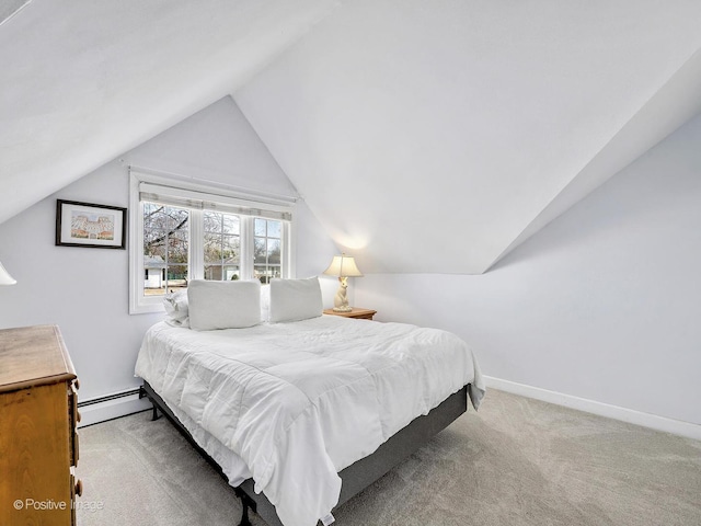 carpeted bedroom with a baseboard heating unit, baseboards, and lofted ceiling