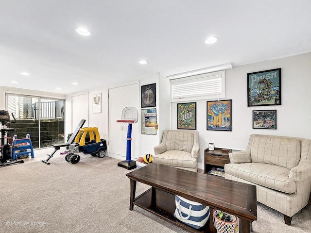 living area featuring recessed lighting and carpet flooring