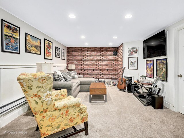 living room featuring baseboard heating, recessed lighting, brick wall, and carpet