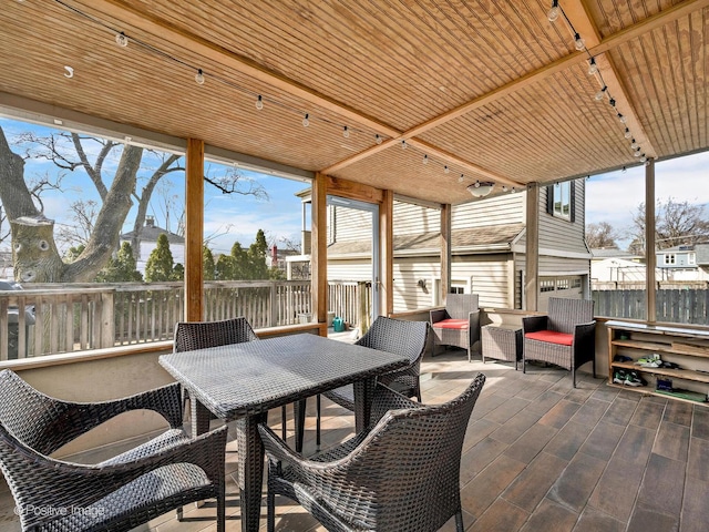 view of patio / terrace featuring outdoor dining area and fence