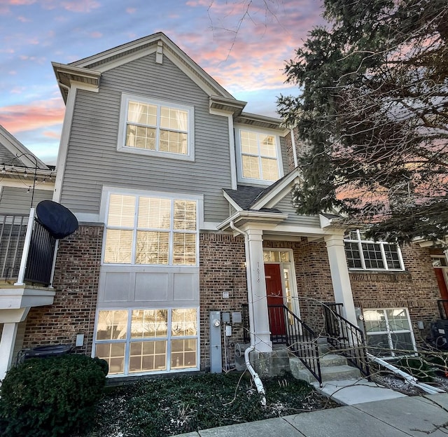 view of front of house with brick siding