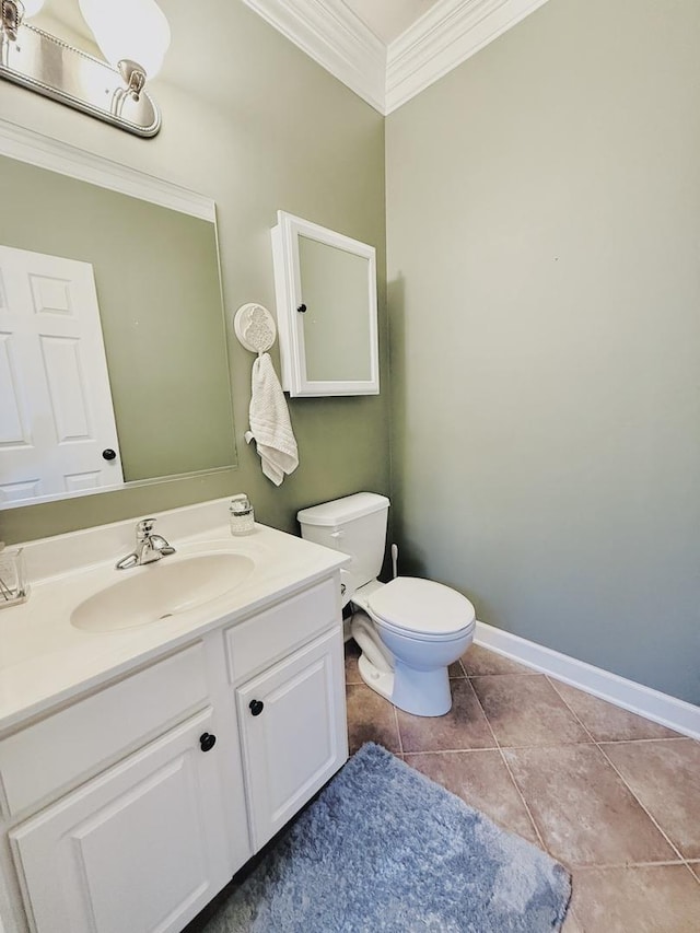 half bathroom featuring baseboards, toilet, tile patterned flooring, crown molding, and vanity