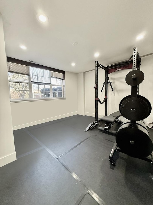 workout area with recessed lighting and baseboards