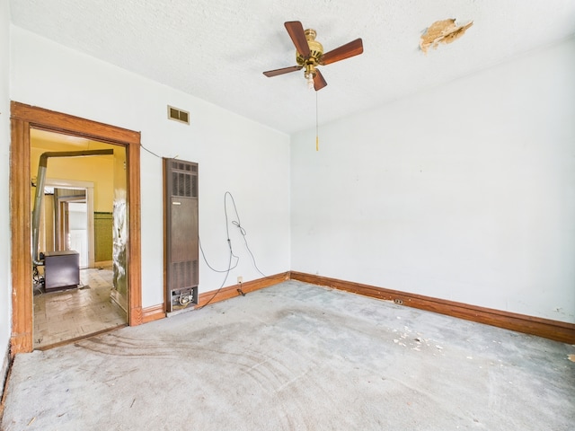 6725 S Justine St, Chicago, IL 60636 - empty room with a heating unit, carpet, baseboards, and ceiling fan