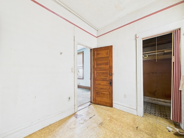 6725 S Justine St, Chicago, IL 60636 - unfurnished bedroom featuring tile patterned floors and a closet