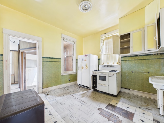 6725 S Justine St, Chicago, IL 60636 - kitchen featuring white appliances, open shelves, tile walls, wainscoting, and light floors