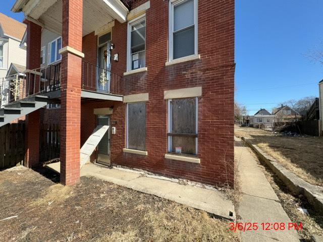 back of property with brick siding