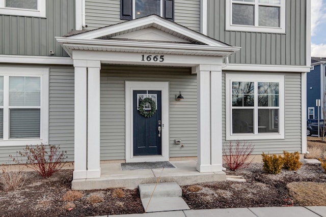 property entrance with board and batten siding