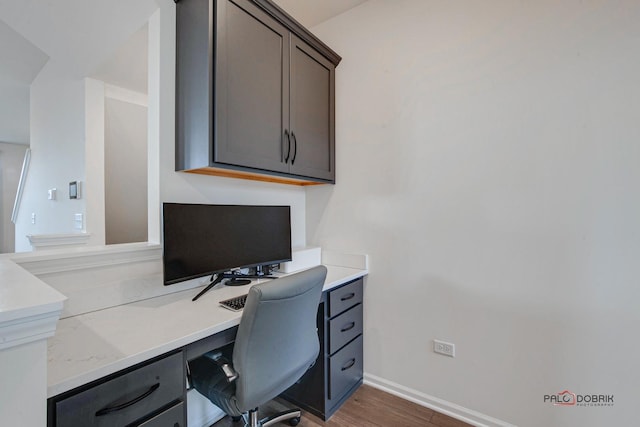 office area featuring wood finished floors and baseboards