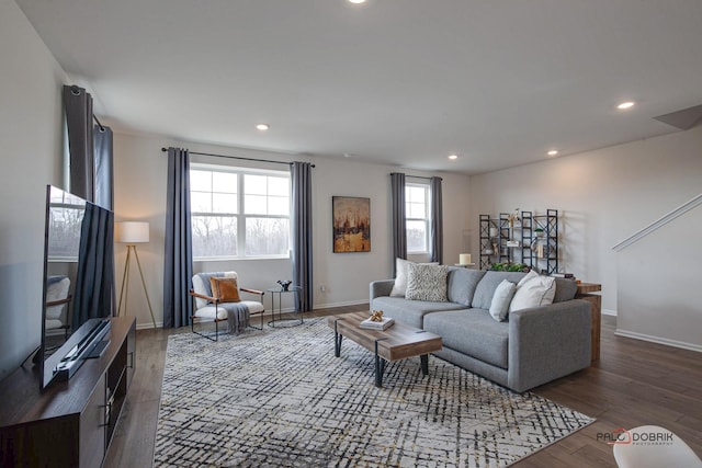 living area with recessed lighting, baseboards, and wood finished floors