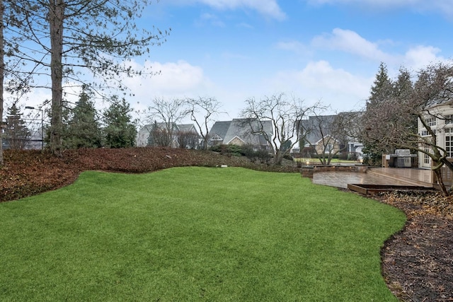 view of yard with a wooden deck