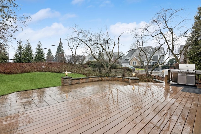 wooden terrace with a yard and a patio area