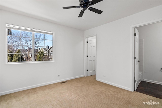 unfurnished bedroom featuring visible vents, baseboards, and carpet