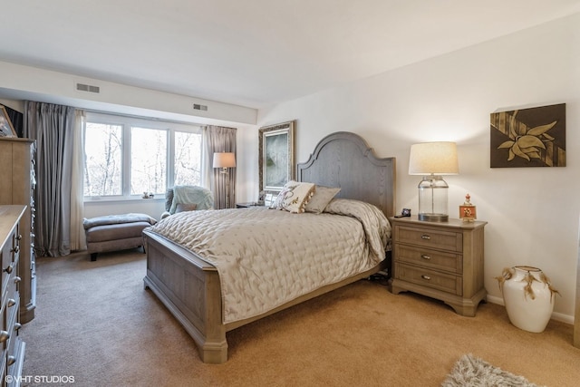 bedroom featuring visible vents and light colored carpet