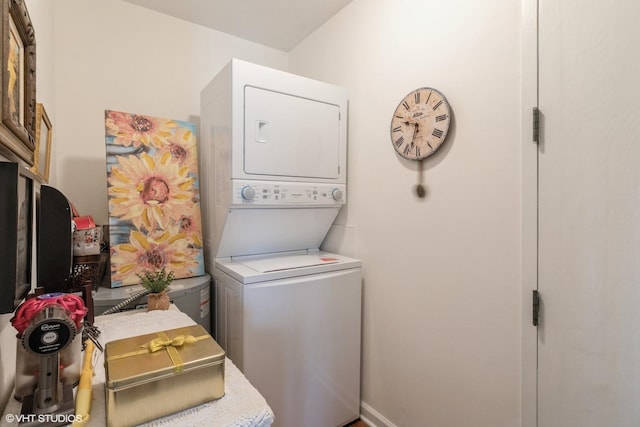 laundry area with stacked washer and dryer