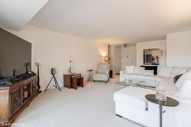 living area featuring light colored carpet