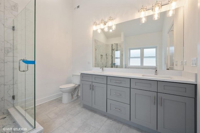 full bathroom with double vanity, visible vents, toilet, a shower stall, and a sink