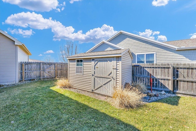 view of shed with a fenced backyard