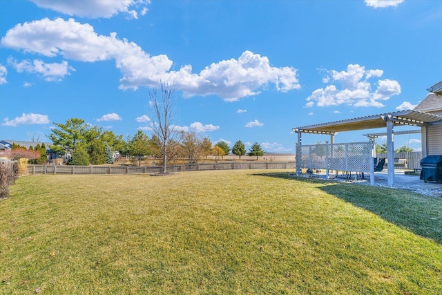 view of yard featuring fence and a pergola