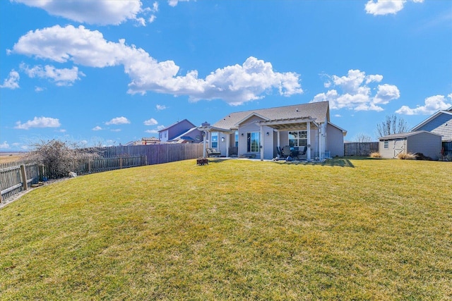 rear view of house featuring a yard, a patio area, a fenced backyard, and a pergola