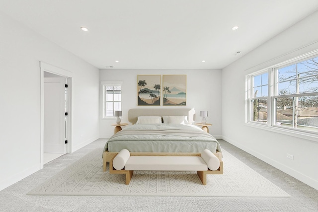 bedroom with recessed lighting, baseboards, and carpet