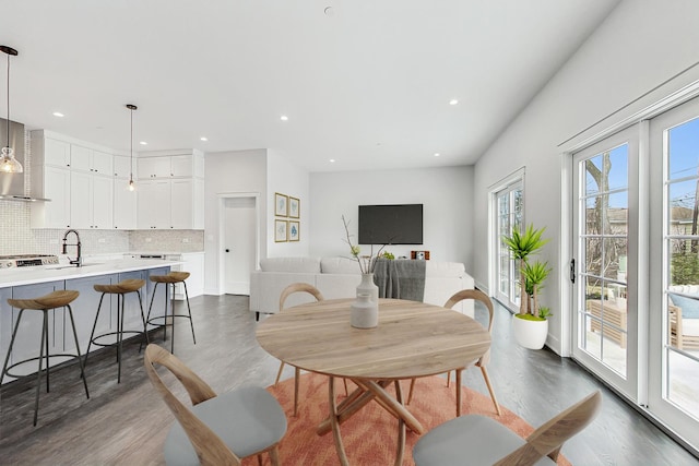 dining area featuring recessed lighting and wood finished floors