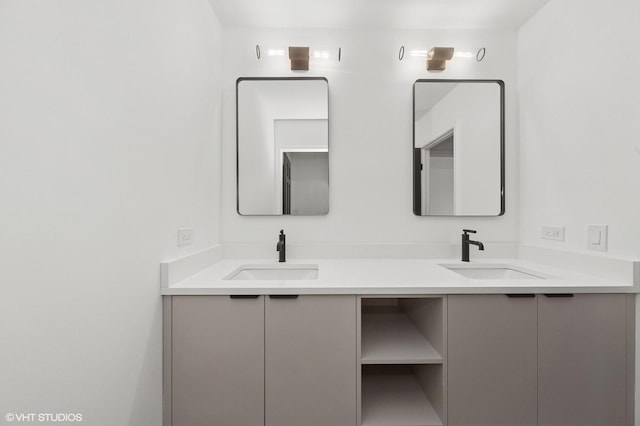 bathroom with double vanity and a sink