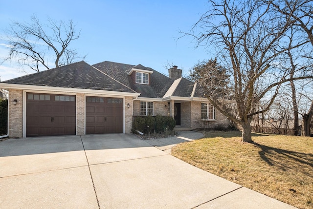 view of front of house with brick siding, driveway, an attached garage, and a front lawn