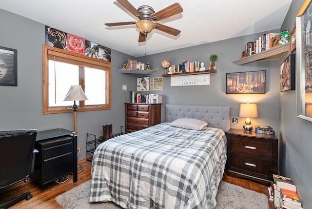 bedroom featuring a ceiling fan and wood finished floors