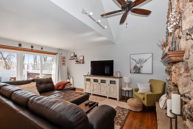 living room with wood finished floors, high vaulted ceiling, and ceiling fan