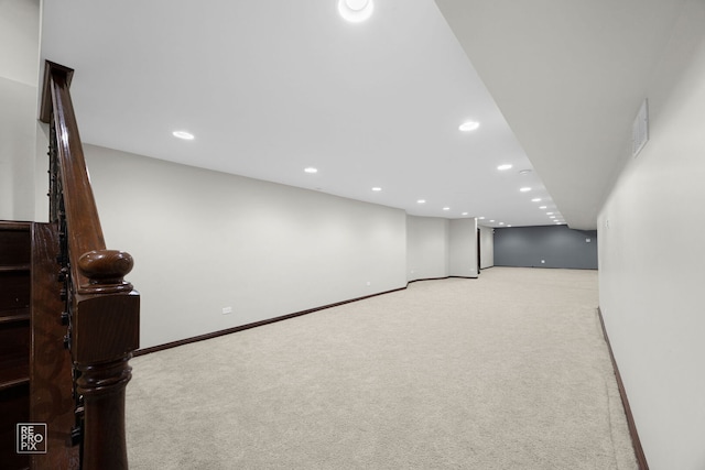 finished basement with baseboards, carpet, visible vents, and recessed lighting