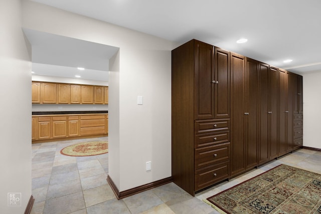 interior space with recessed lighting and baseboards