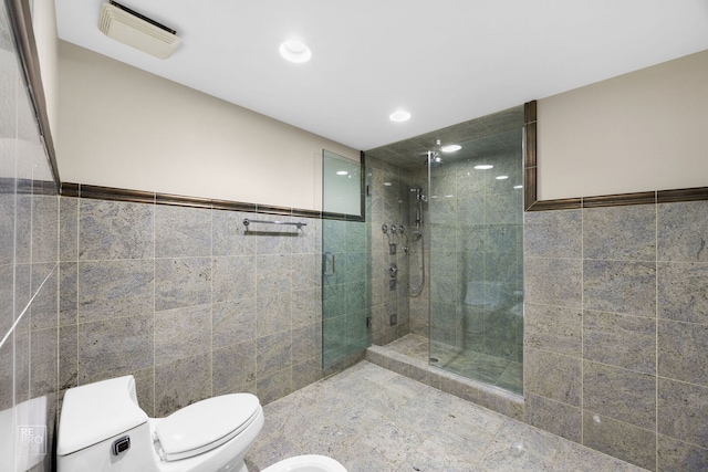 bathroom featuring visible vents, toilet, a walk in shower, tile walls, and recessed lighting