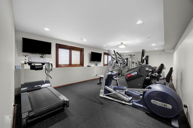 exercise area with baseboards and recessed lighting