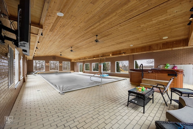 game room featuring brick floor, lofted ceiling, a hot tub, brick wall, and wooden ceiling