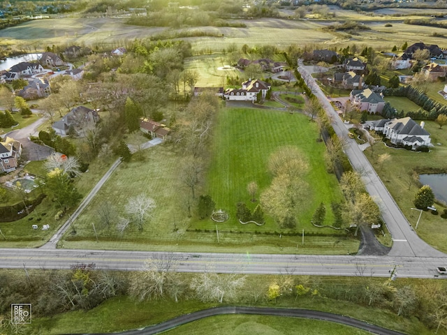 birds eye view of property with a residential view