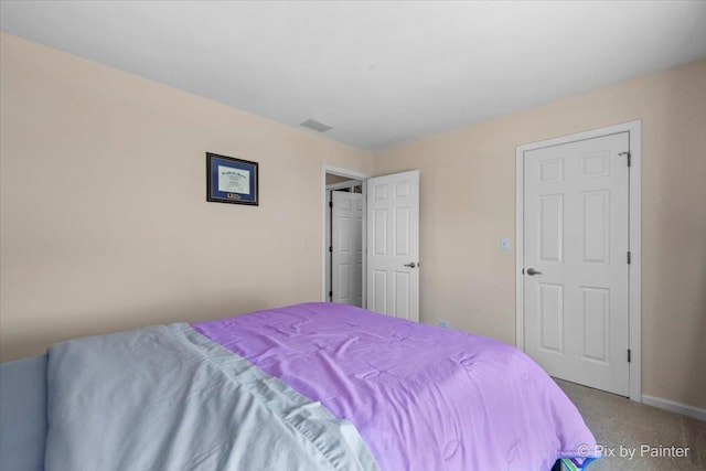 bedroom featuring carpet and baseboards