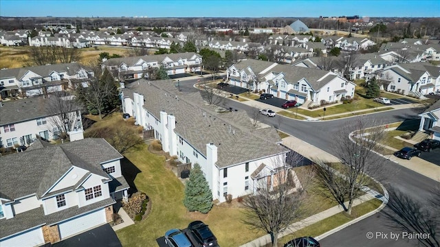 birds eye view of property with a residential view