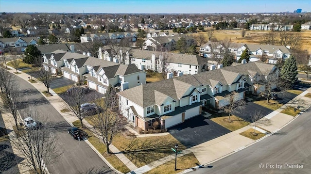 birds eye view of property with a residential view