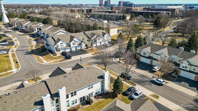 birds eye view of property with a residential view