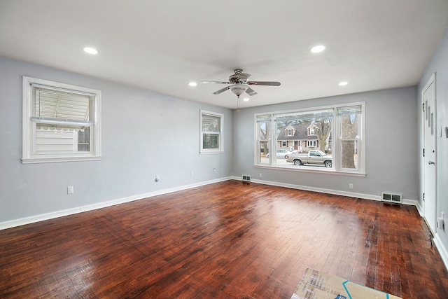 unfurnished room with visible vents, recessed lighting, baseboards, ceiling fan, and dark wood-style flooring