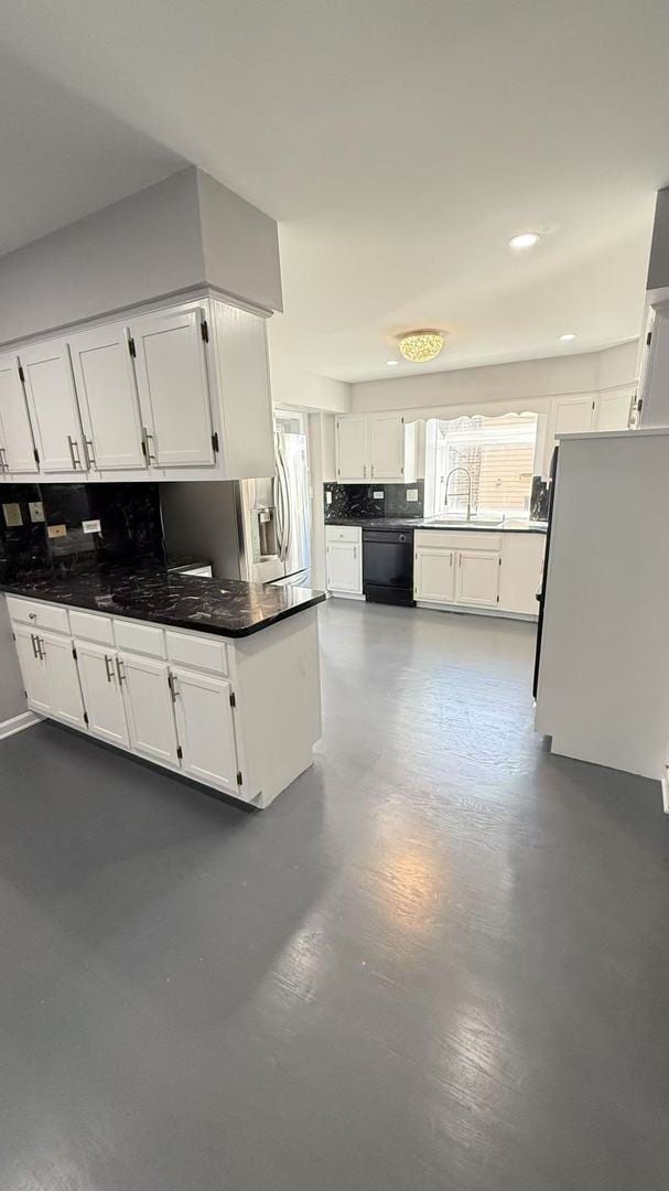 kitchen featuring black dishwasher, tasteful backsplash, white cabinetry, and stainless steel refrigerator with ice dispenser