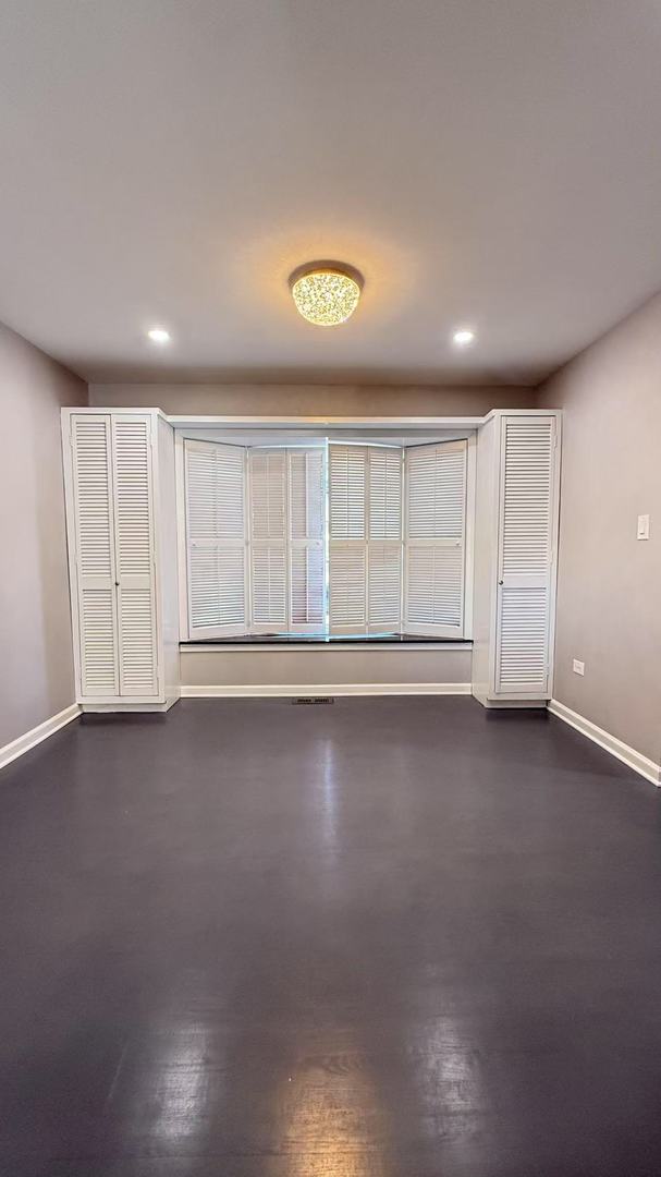 empty room with recessed lighting and baseboards