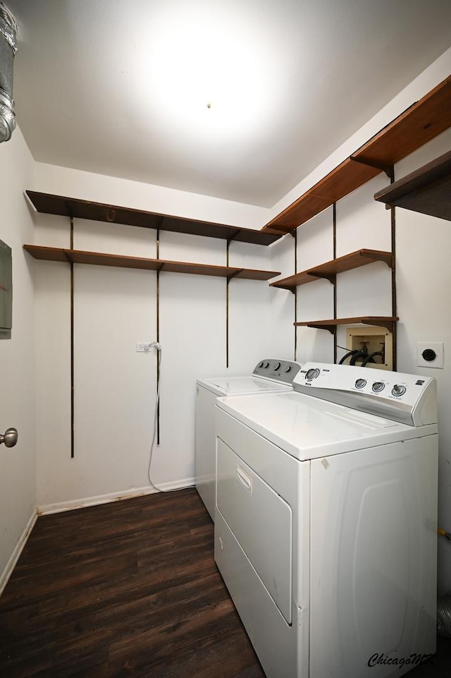 laundry room featuring laundry area, baseboards, dark wood-type flooring, and washer and dryer